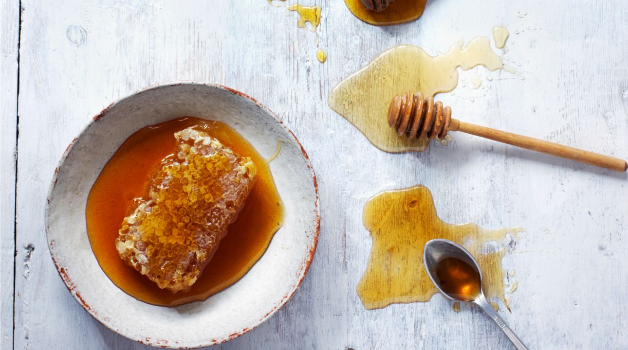 Different types of honey, lavender honey, orange blossom honey, rosemary honey, and beeswax combs