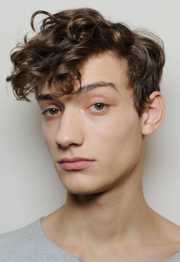 curly side parted hairstyle men