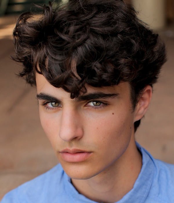 long curls on top hairstyle men