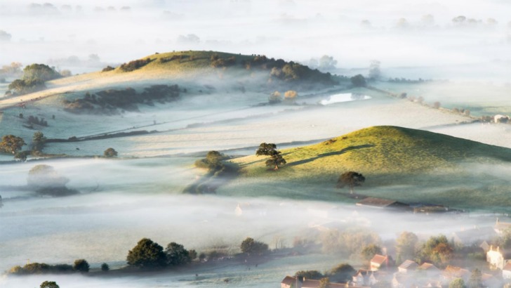 mist over countryside in southwest england photo by bob small