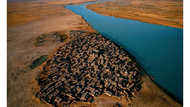 village on the bank of the niger river mali photo by yann arthus bertrand