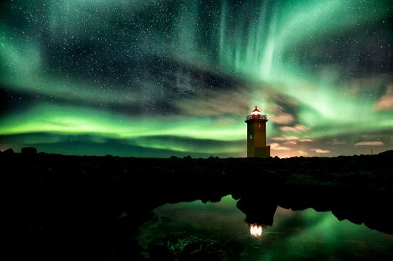 Lighthouse And Aurora-Filled Sky, Iceland