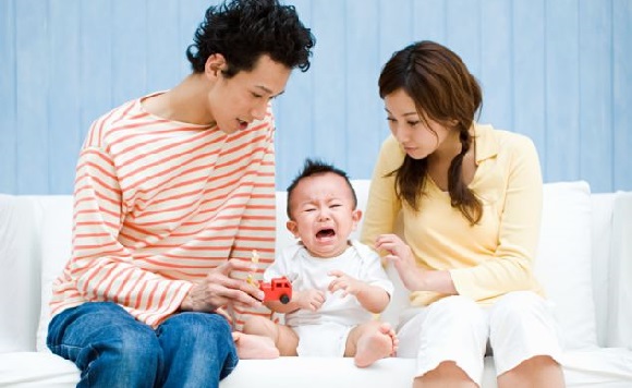 Parents with a crying baby