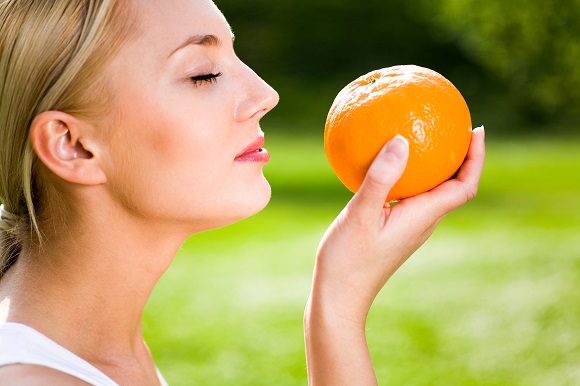 Woman holding an orange